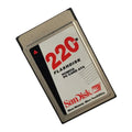 SanDisk 220MB flashdisk PCMCIA PC Card ATA on a white background. Front